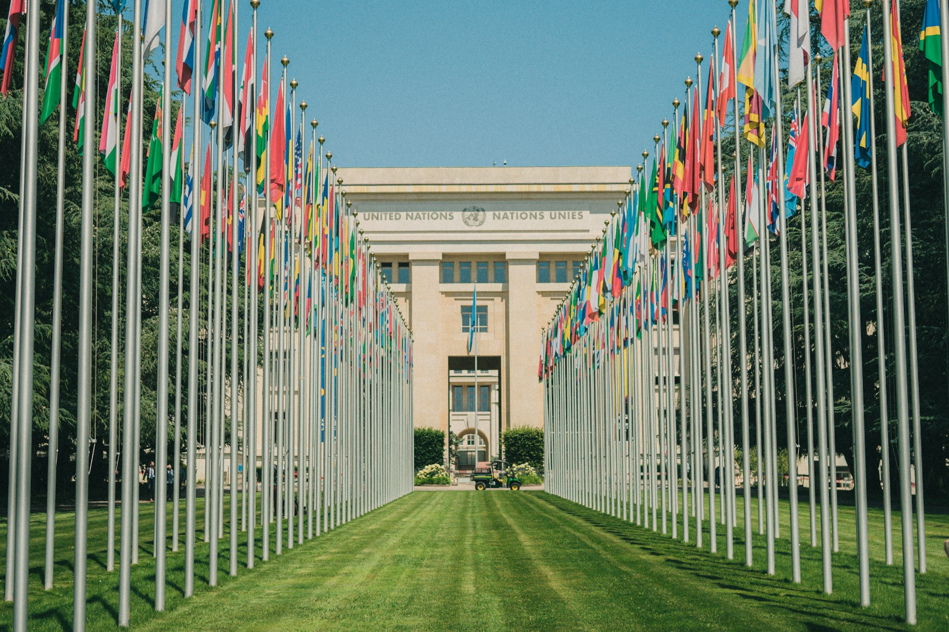 A long row of flags in front of a building